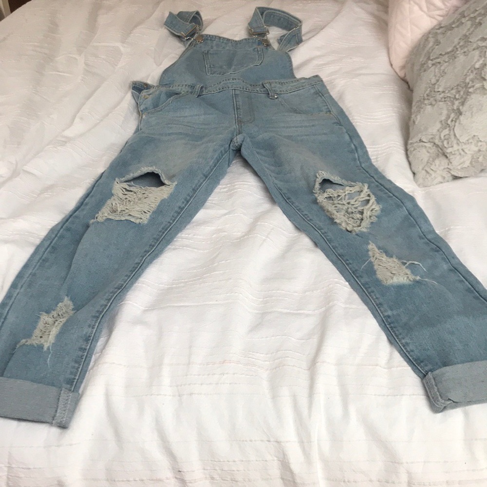 Light blue, ripped overalls from Sorelleuk.